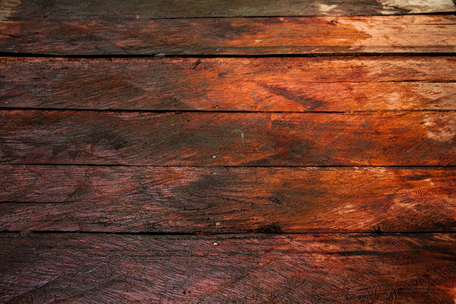 a close up of a piece of wood with peeling paint